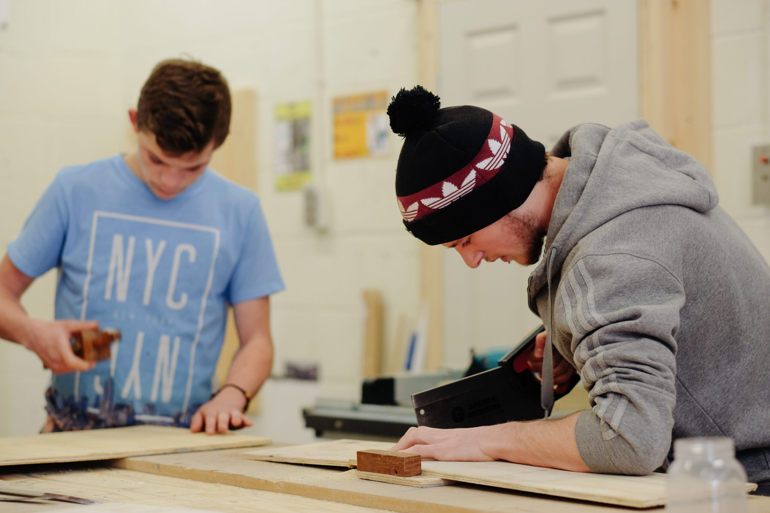 Two leaners working in a construction workshop