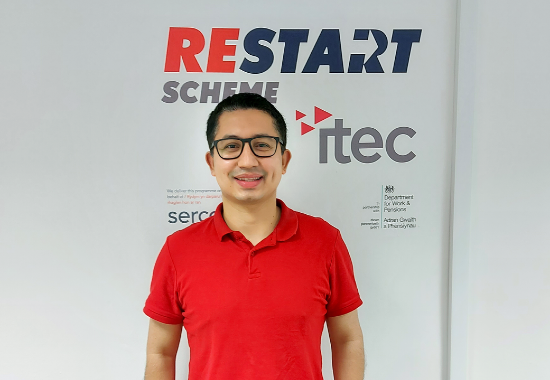 Photo of Victor Margarin with Restart Logo in background