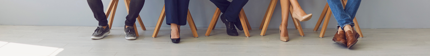 Shot of office workers feet, all sitting on stools
